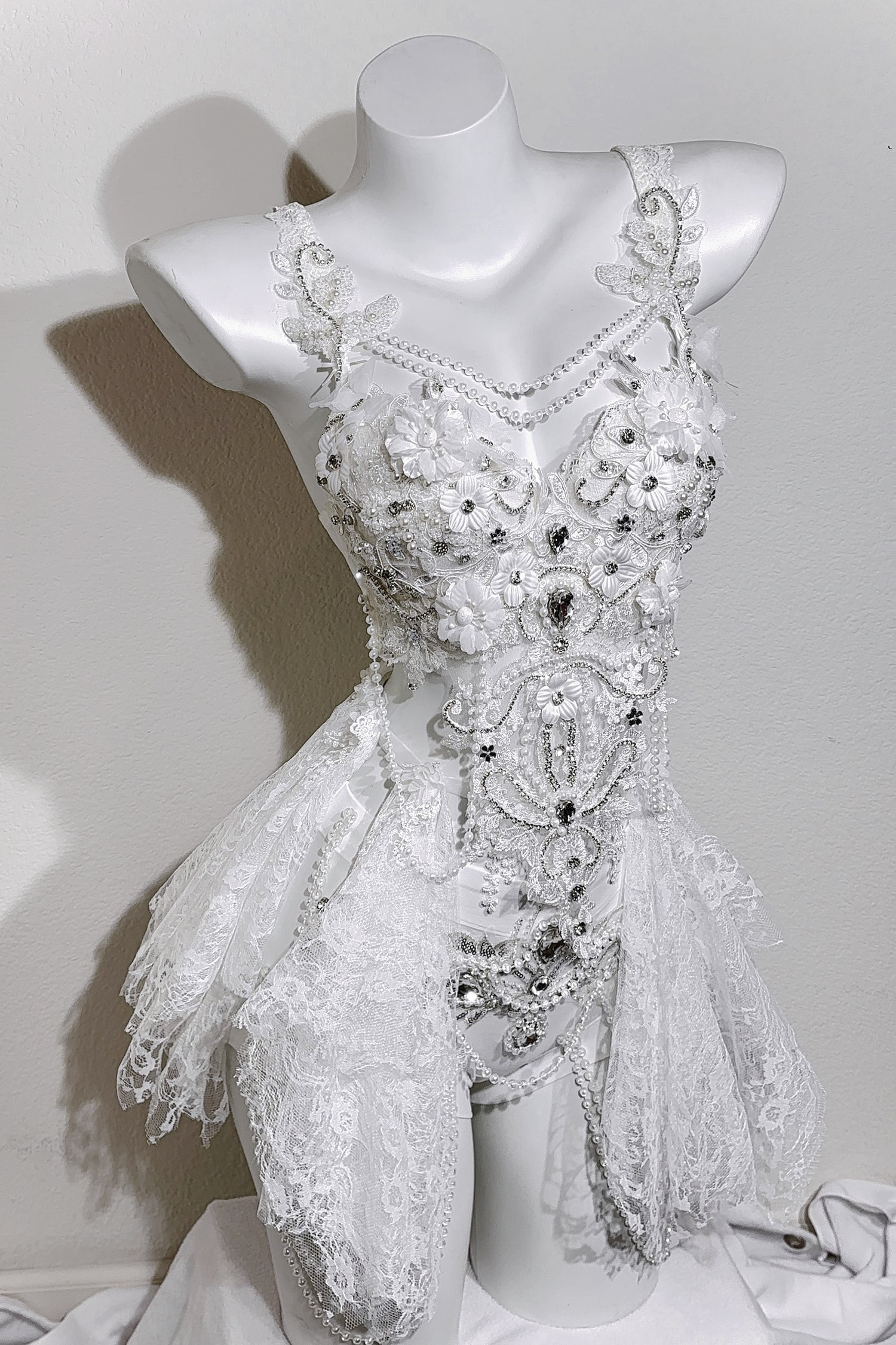 Crystalaisy handmade white rave set with rhinestone bra, lace skirt, and pearl details
